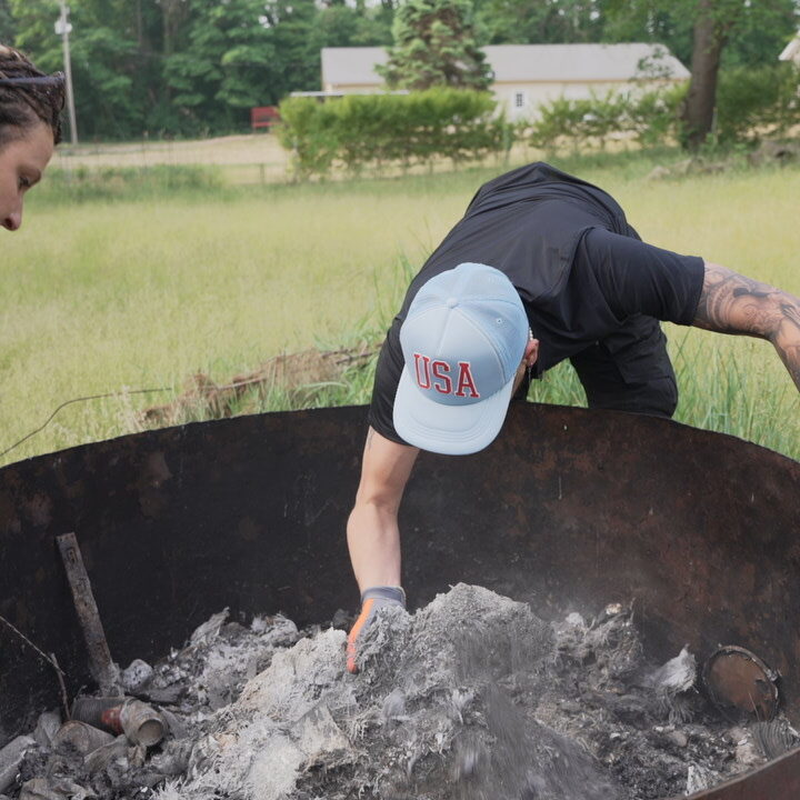 S3 Trip 4 - James and Jess dig through burned debris.